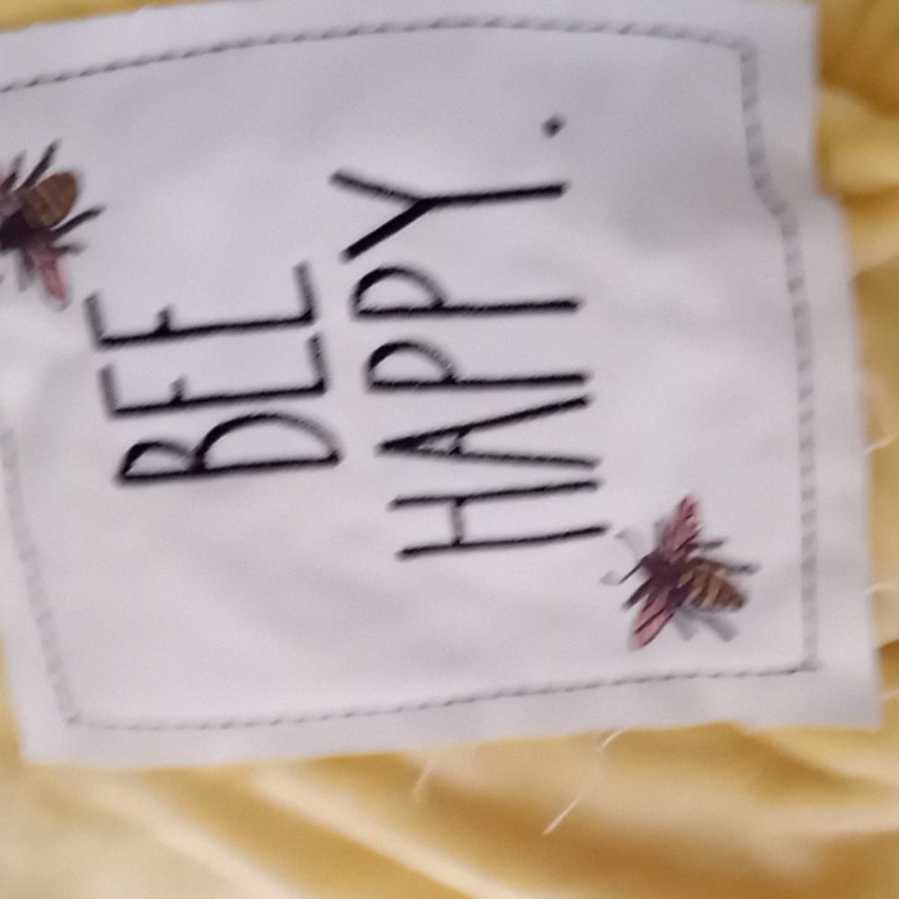 Rae Dunn fleece throw. color is yellow.